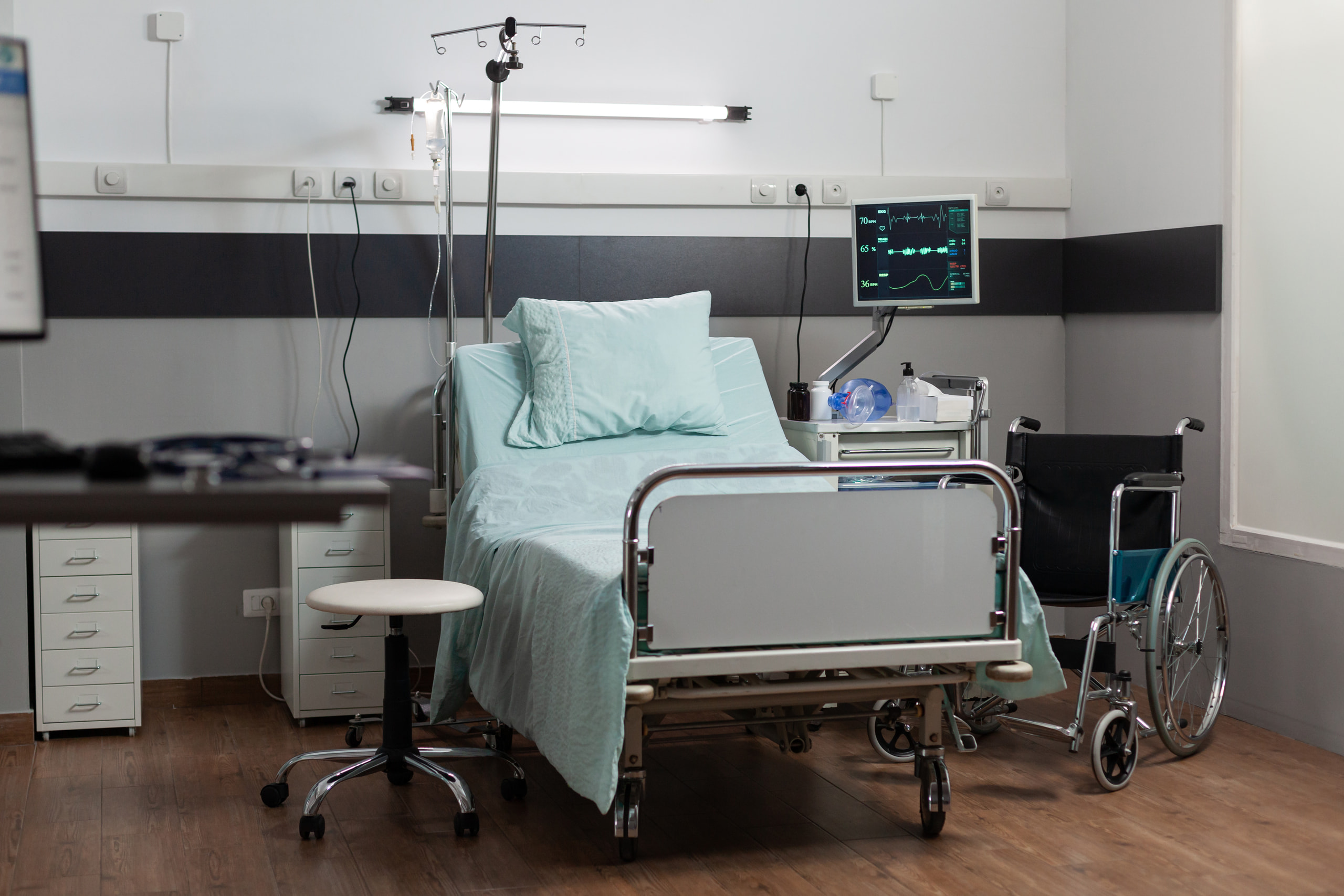 Real hospital bed and patient room furniture photo